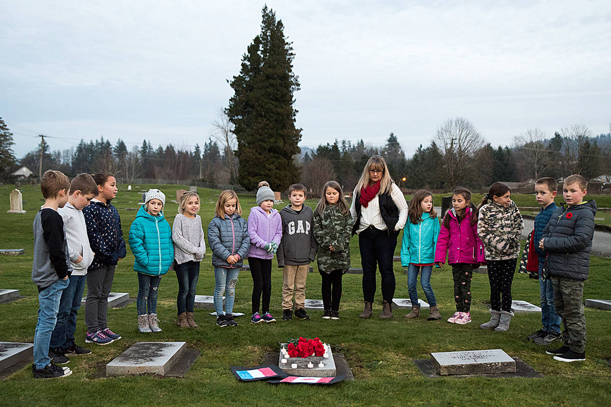 Debbie Mar’s Grade 3/4 class at an Abbotsford soldier’s grave during their field trip to Hazelwood Cemetery. Photo courtesy of Ashley Martens.