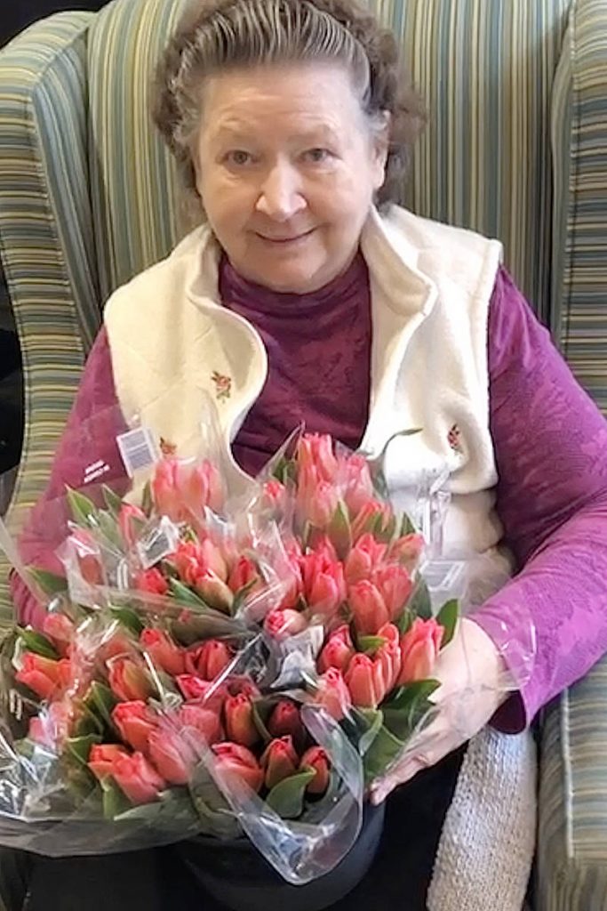 lady with tulips in elderly care home